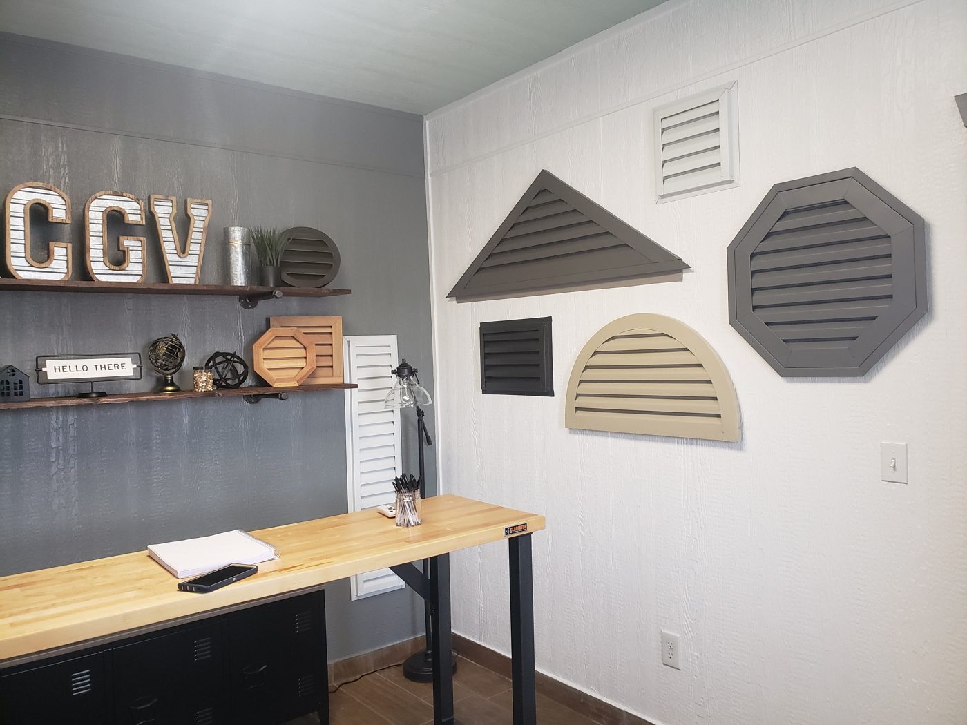 Eye-level view of a variety of gable vents displayed on a wall