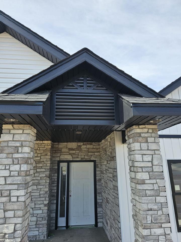 Eye-level view of a custom wooden gable vent with intricate lattice design