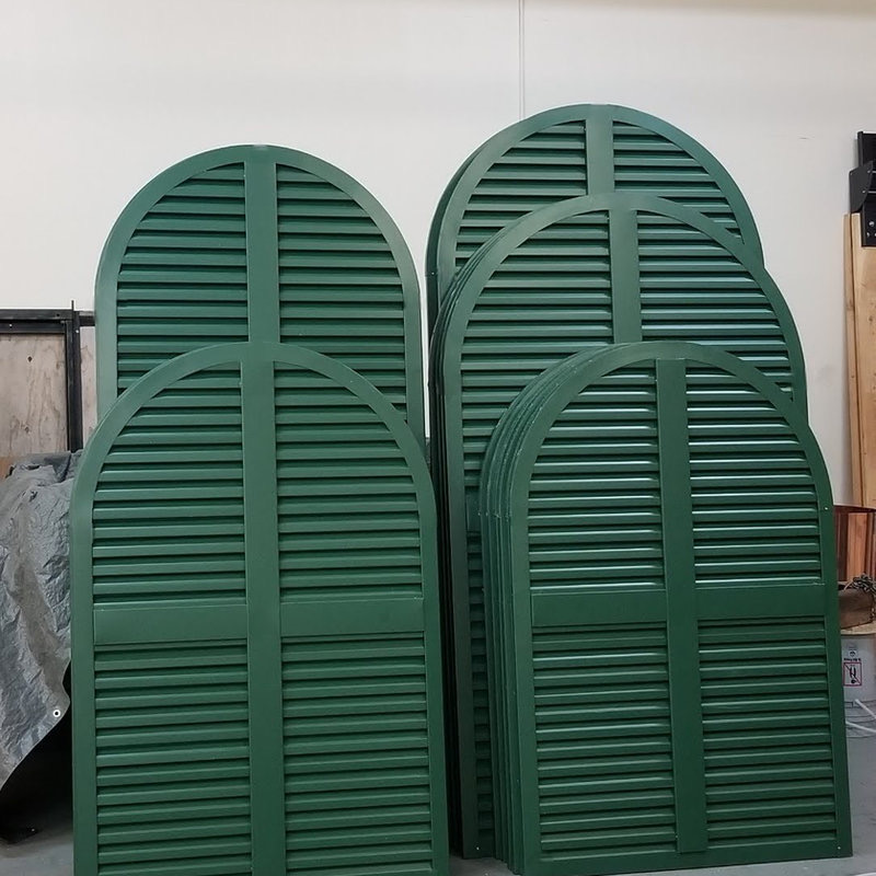 Four large green round top gable vents