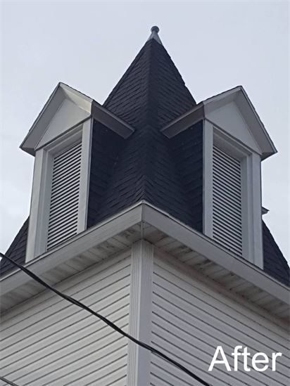 Church bell tower after the remodel, with new louvers