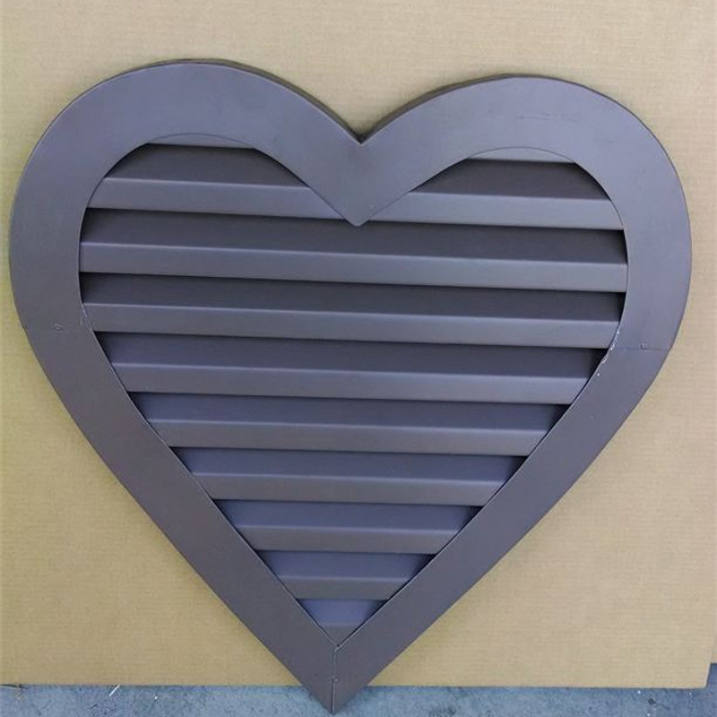 Heart-shaped gable vent in a dark finish